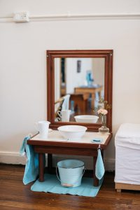 Child sized hand washing mirror table.