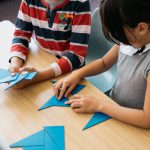 Children working with Montessori blue triangles.