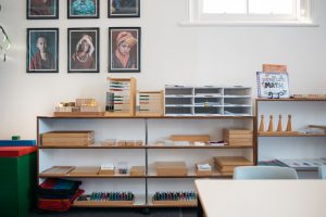 Shelf displaying Montessori mathematics materials.