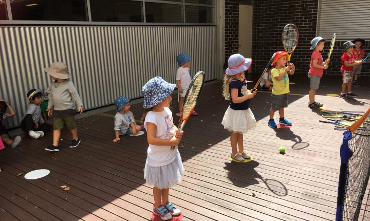 Children playing mini tennis.